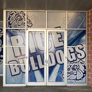 Window graphics for Rice Bulldogs on school entrance doors by 1st Class Graphics in Mansfield, TX