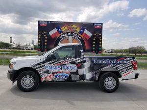Partial wrap for Ennis Ford on a Ford F-150 by 1st Class Graphics in Mansfield, TX