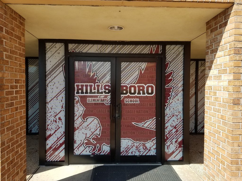 Window graphics for Hillsboro Elementary School on a school entrance by 1st Class Graphics in Mansfield, TX