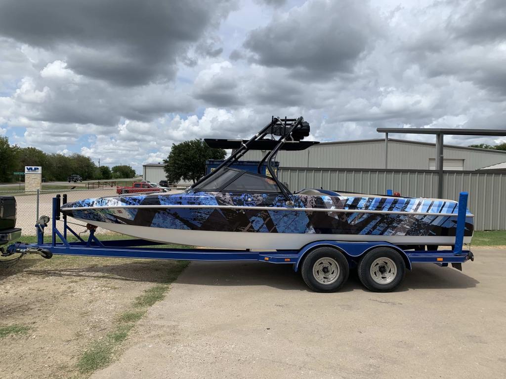 Full vehicle wrap on a wakeboard boat by 1st Class Graphics in Mansfield, TX