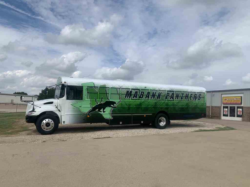 Partial wrap for Mabank Panthers on an IC Bus school bus by 1st Class Graphics in Mansfield, TX