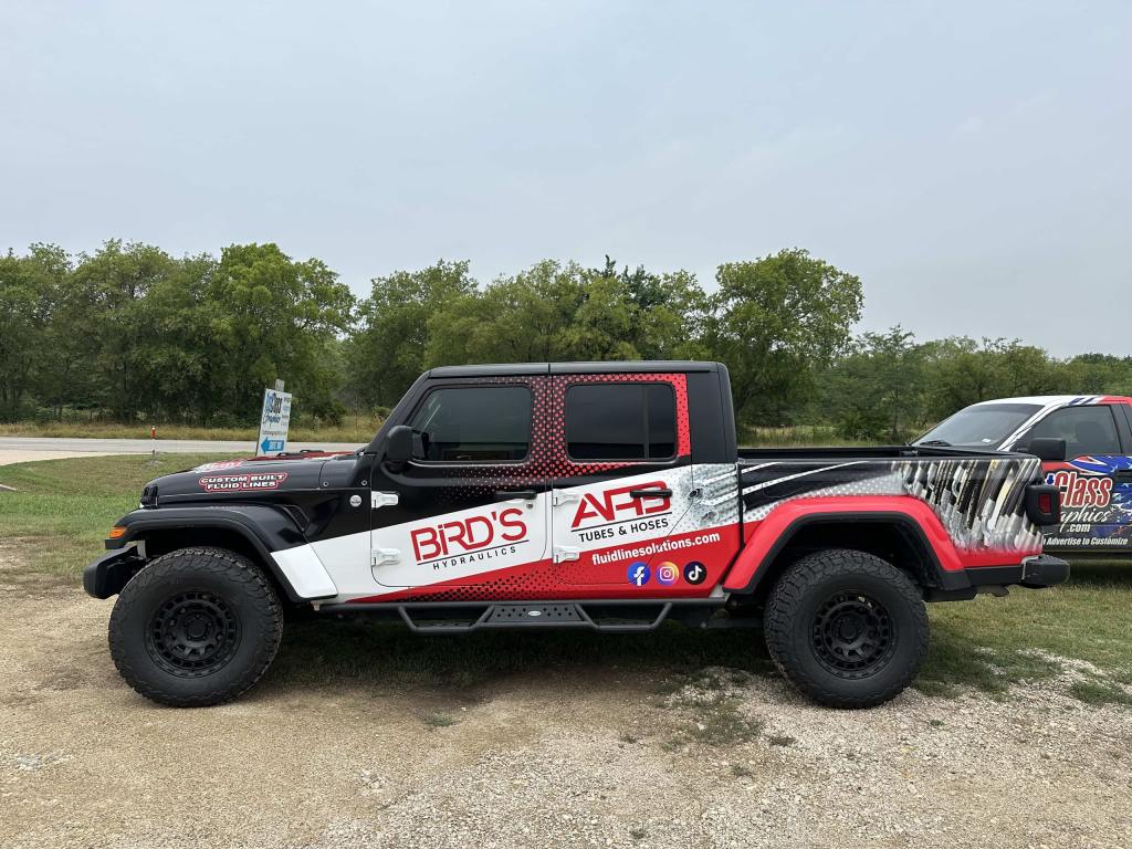 Partial wrap for Bird's Hydraulics on a Jeep Gladiator by 1st Class Graphics in Mansfield, TX