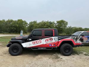 Partial wrap for Bird's Hydraulics on a Jeep Gladiator by 1st Class Graphics in Mansfield, TX