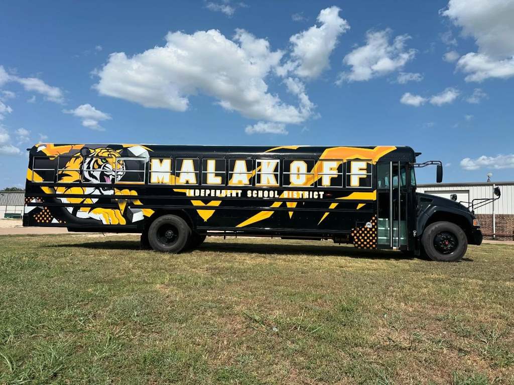 Full vehicle wrap for Malakoff Independent School District on a school bus by 1st Class Graphics in Mansfield, TX