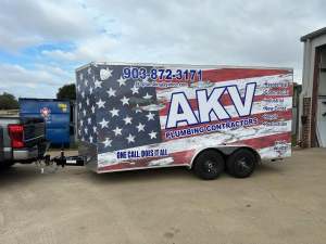 Trailer wrap for AKV Plumbing Contractors on an enclosed trailer by 1st Class Graphics in Mansfield, TX