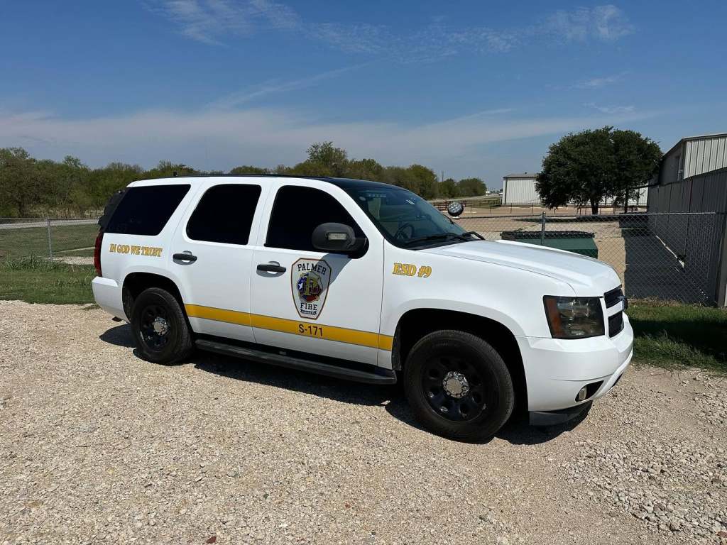 Vinyl lettering for Palmer Fire ESD #9 on a Chevrolet Tahoe by 1st Class Graphics in Mansfield, TX