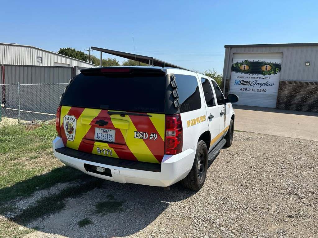Vinyl lettering for Palmer Fire ESD #9 on a Chevrolet Tahoe by 1st Class Graphics in Mansfield, TX