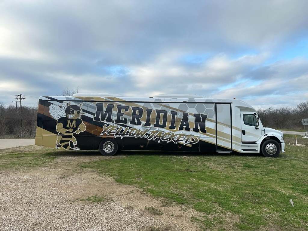 Partial wrap for Meridian Yellow Jackets on an activity bus by 1st Class Graphics in Mansfield, TX