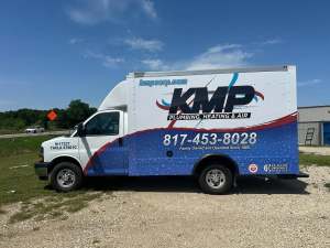 Partial wrap for KMP Plumbing, Heating & Air on a box truck by 1st Class Graphics in Mansfield, TX
