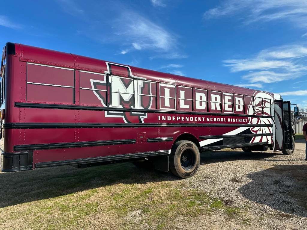 Full vehicle wrap for Mildred Independent School District on a school bus by 1st Class Graphics in Mansfield, TX