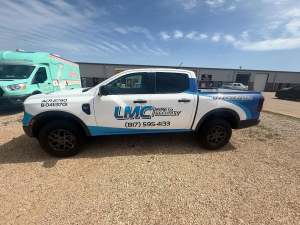 Partial wrap for LMC Fire & Security on a Ford Ranger by 1st Class Graphics in Mansfield, TX