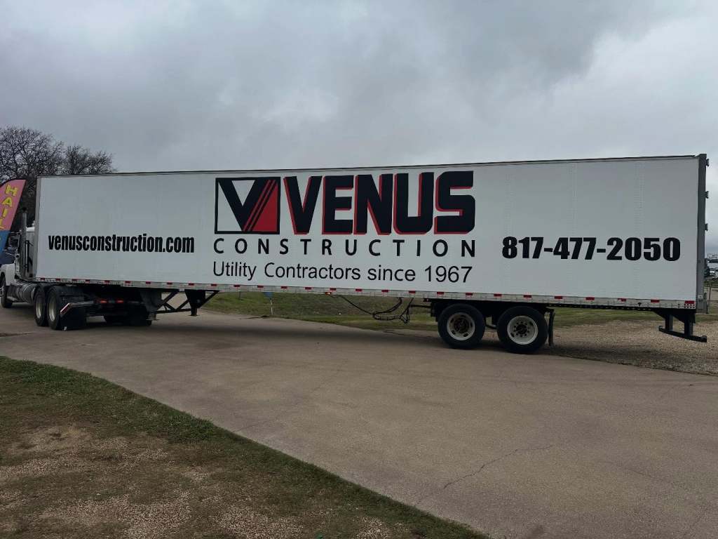 Vinyl lettering for Venus Construction on a semi trailer by 1st Class Graphics in Mansfield, TX