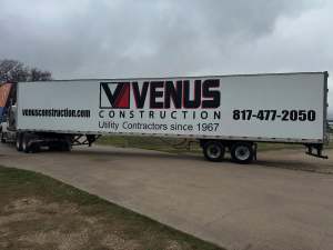 Vinyl lettering for Venus Construction on a semi trailer by 1st Class Graphics in Mansfield, TX