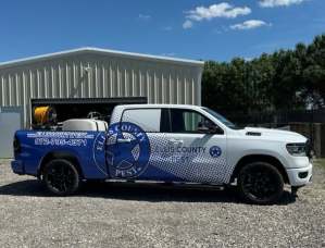 Partial wrap for Ellis County Pest on a Ram 1500 by 1st Class Graphics in Mansfield, TX